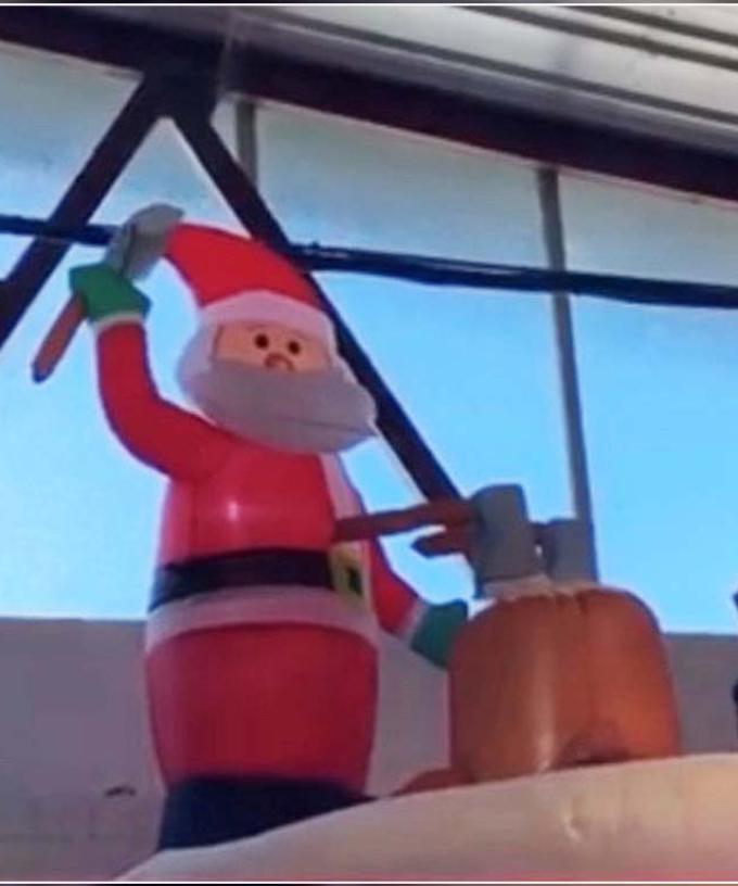 Bunnings Has A New Axe Throwing Santa Inflatable That Could Easily Pass For Halloween